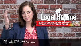 Annie Fitzsimmons - a white woman with brown hair standing in front of a brick wall with the video title on the wall. She is wearing a blue blazer with a red shirt underneath.